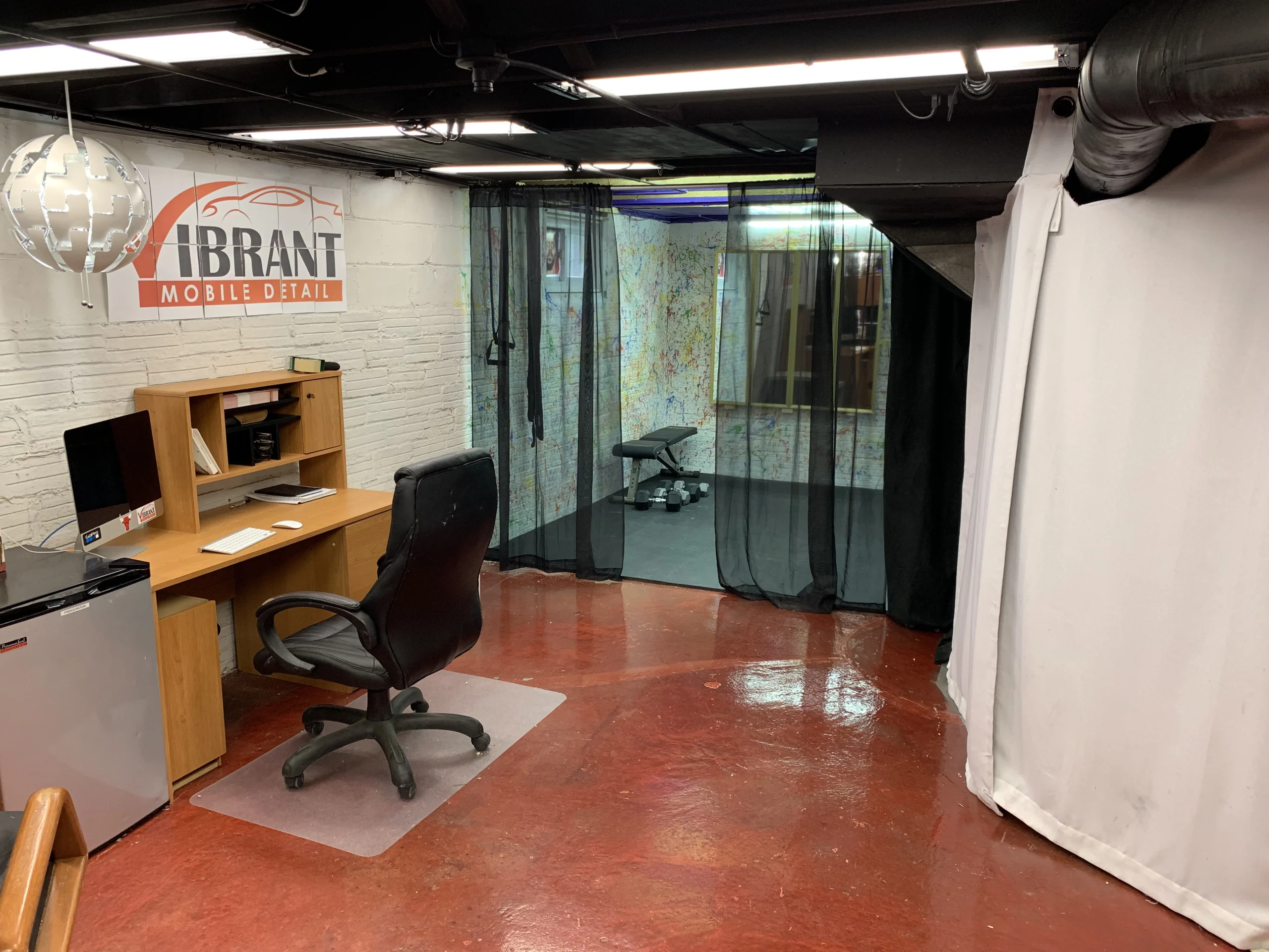 Dedicated workstation and office interior featuring company branding.