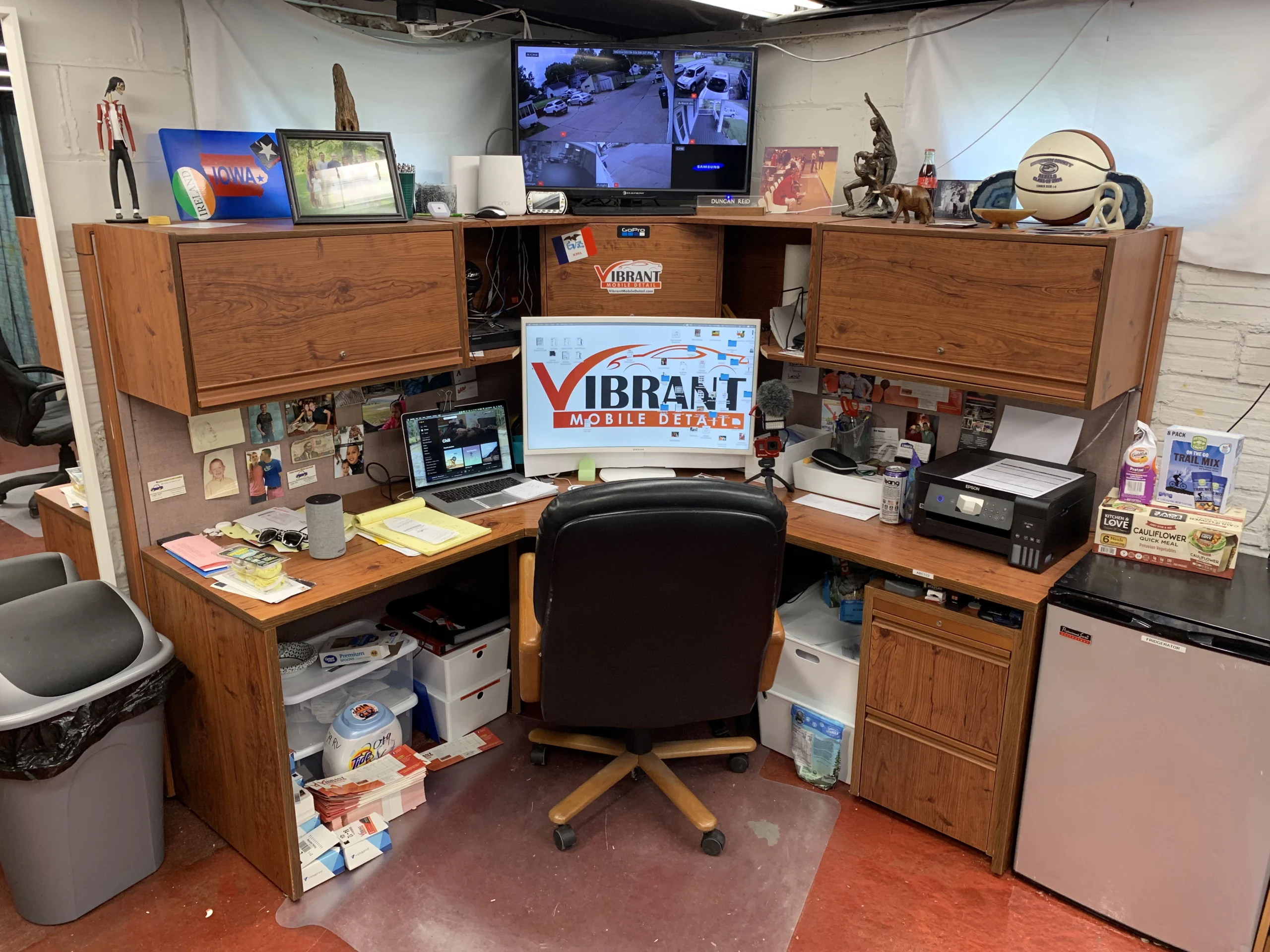 Administrative desk with branded monitors for scheduling and dispatch.